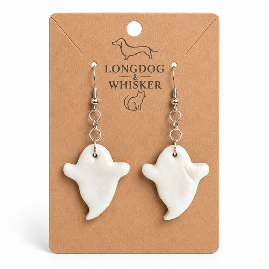 White ghost earrings on Longdog & Whisker display card