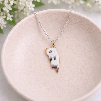 Scruffles Cat Necklace - White displayed in a lifestyle product photo