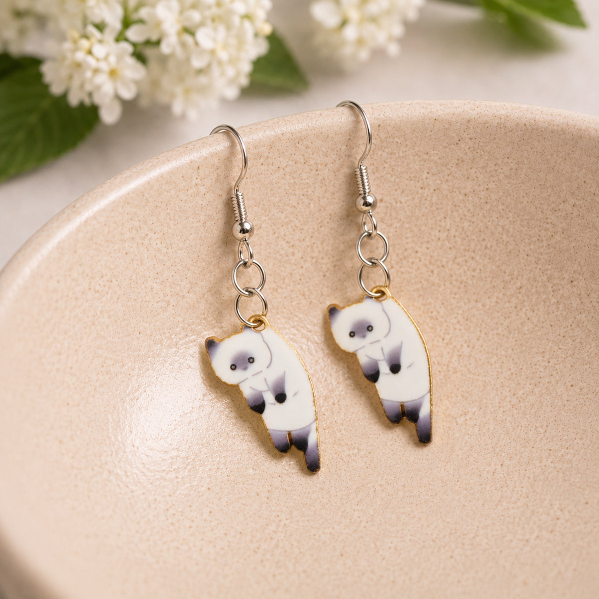 Scruffles Cat Earrings - White displayed in a lifestyle product photo