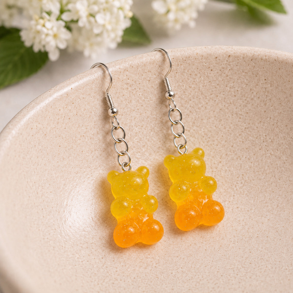 Gummy Bear Earrings - Yellow / Orange displayed in a lifestyle product photo