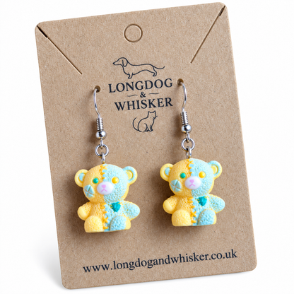 Close detail of Yellow Pastel Patchwork Bear Earrings and silver-tone hooks