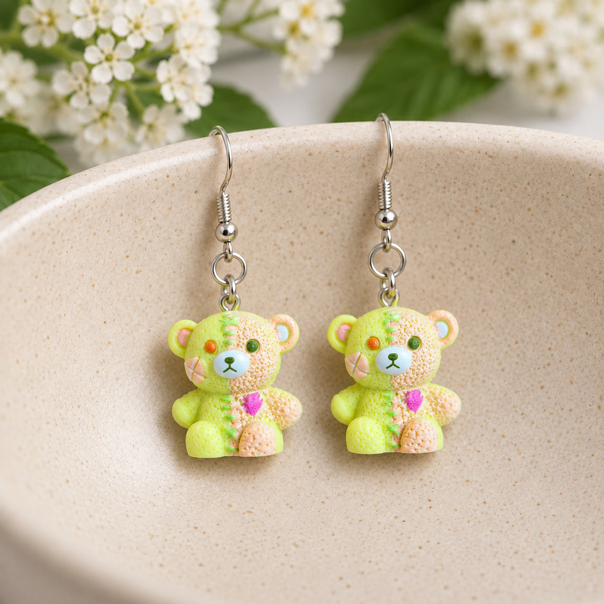 Yellow & Peach Pastel Stitched Zombie Bear Earrings in ceramic bowl lifestyle scene