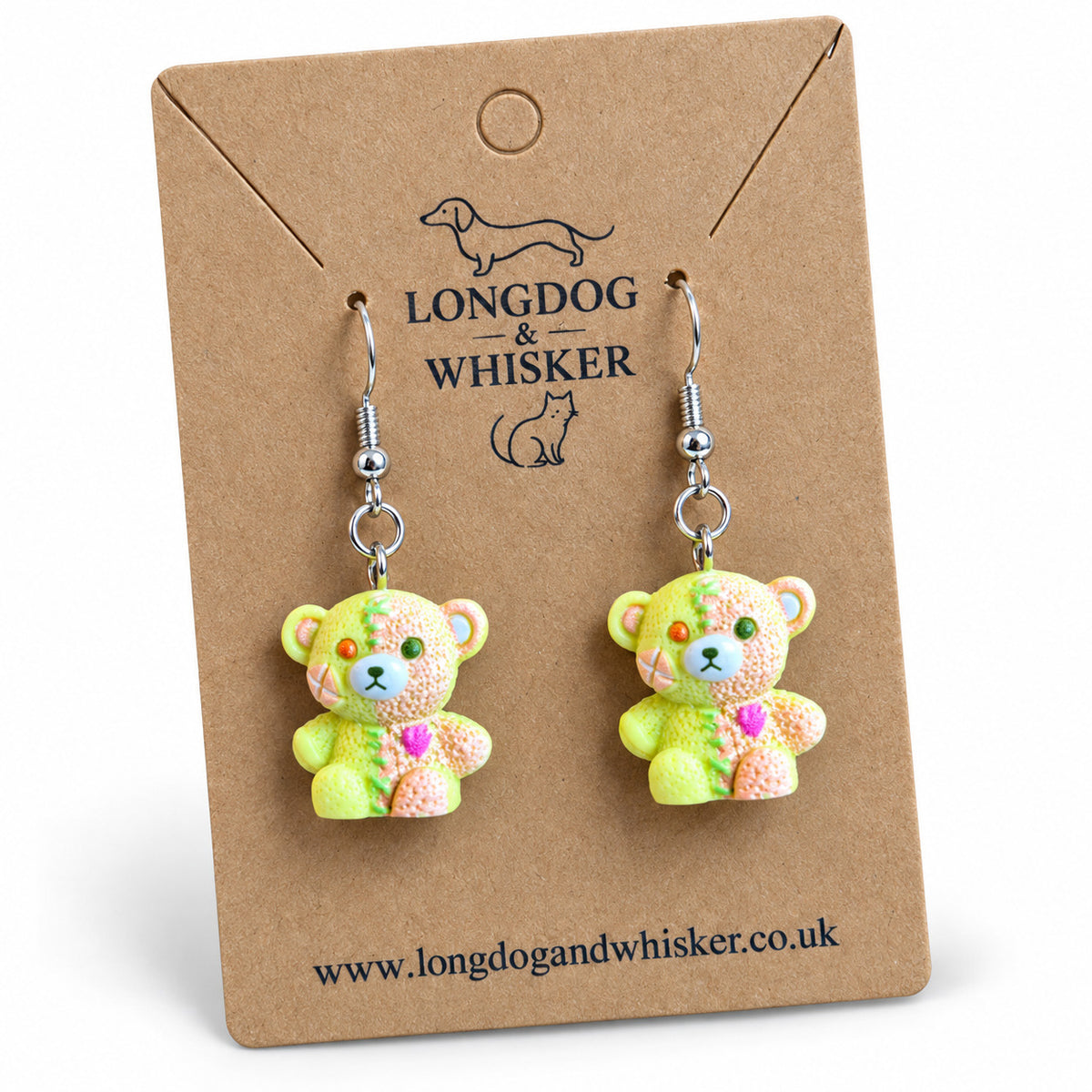 Close detail of Yellow & Peach Pastel Stitched Zombie Bear Earrings and silver-tone hooks
