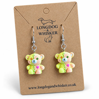 Close detail of Yellow & Peach Pastel Stitched Zombie Bear Earrings and silver-tone hooks