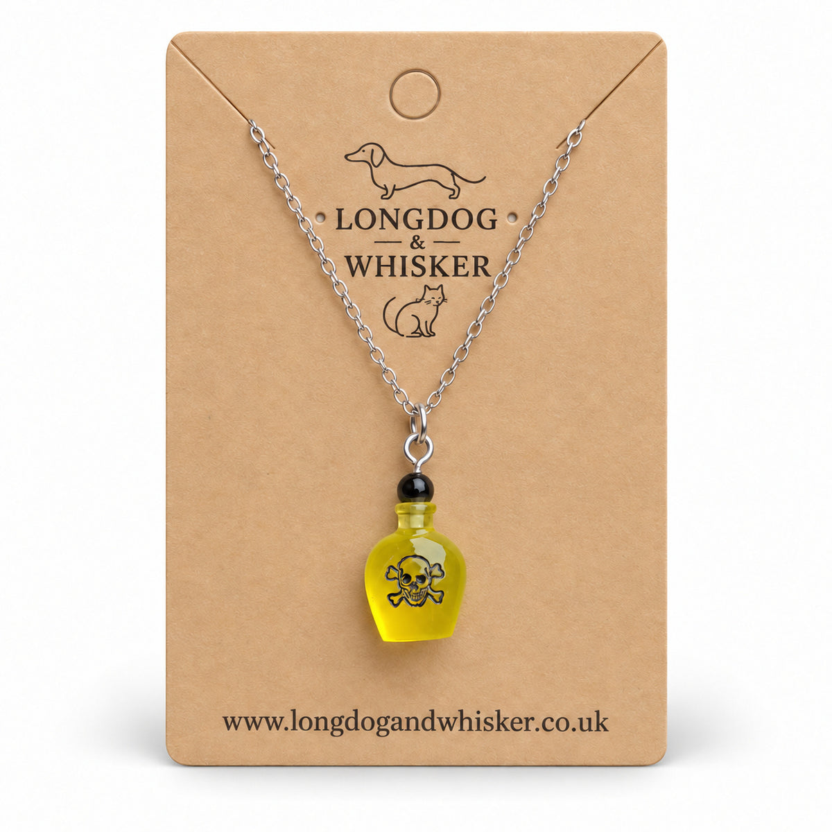 Yellow poison bottle necklace with silver chain on a Longdog & Whisker kraft card.